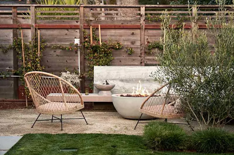 Concrete firepit in backyard.