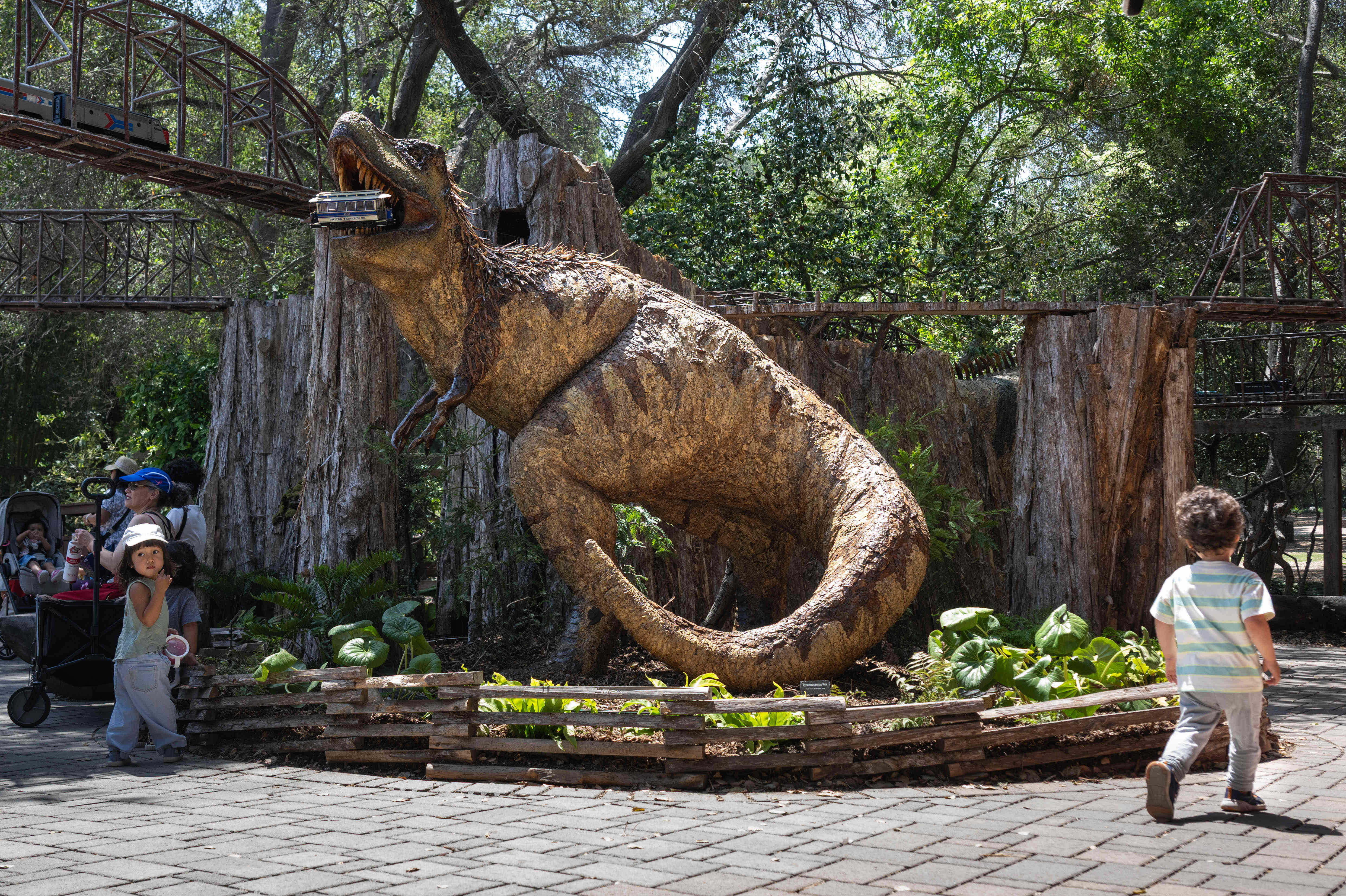 Children check out a Tyrannosaurus rex made from natural materials...
