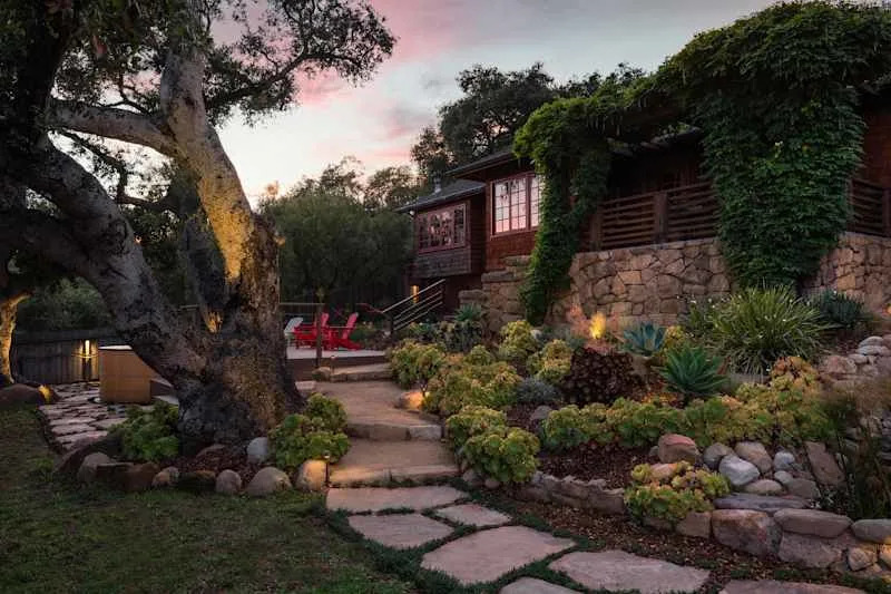 Stone walkway and retaining wall in front yard.