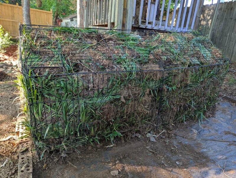 The removed grass in a cage.