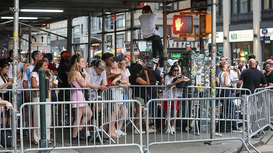 People gathered behind barricades near Madison Square Garden