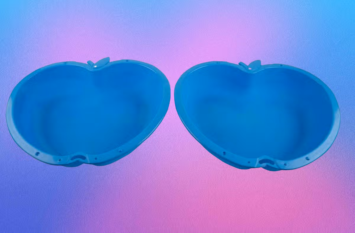 Blue sand pit shaped like an apple pictured on a colourful background 
