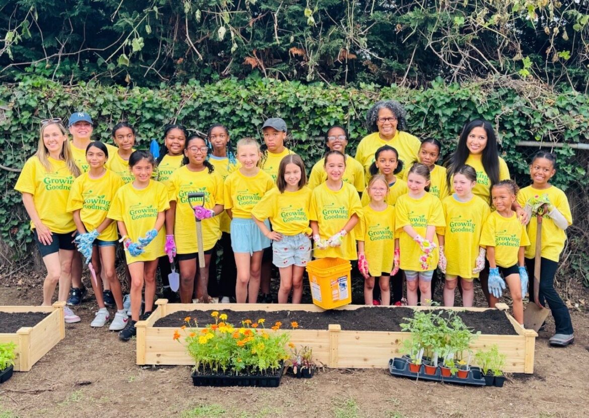 Girl Scouts from several Baldwin-area troops gathered at Meadow Elementary School after planting a new community garden as part of the Growing Goodness initiative. The garden will provide fresh produce for Bethany House and serve as an outdoor classroom for Meadow students.