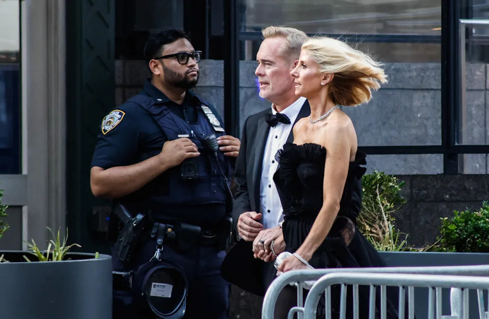 US sportscaster Joe Buck (L) and his wife US sportscaster Michelle Beisner-Buck arrive outside Madison Square Garden, the reported venue for the wedding celebrations of pop singer Taylor Swift and pro-athlete Travis Kelce, in New York City on July 3, 2026. Swift and Kelce's official wedding plans are tightly under wraps, but New York is bracing to host the celebrity marriage of the year this week at Madison Square Garden. The wedding will reportedly take place Friday with a star-studded guest list of around 1,000, including models Gigi Hadid and Cara Delevingne, singer Selena Gomez, and actress Zoe Kravitz -- all known to be close Swift pals -- and Kelce's Kansas City Chiefs teammates. (Photo by kena betancur / AFP via Getty Images)