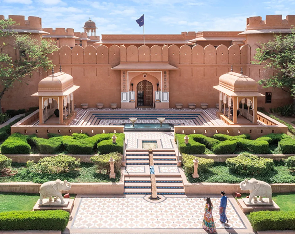 The Oberoi Rajvilas in Jaipur spans 32 acres of jasmine-scented gardens and historic courtyards, offering one of India's most romantic settings for a proposal.