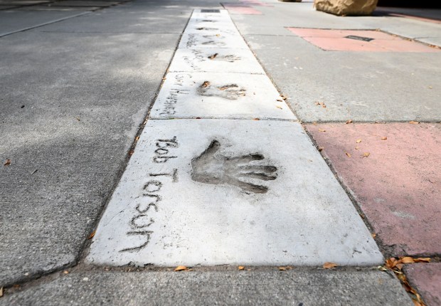 Bob Torson's handprint in the concrete is pictured Tuesday, Aug. 3, 2026, at Benson Sculpture Park in Loveland. Torson helped organize and promote the first Sculpture in the Park show 42 years ago and was one of the founding members of the High Plains Arts Council board. (Jenny Sparks/Loveland Reporter-Herald)