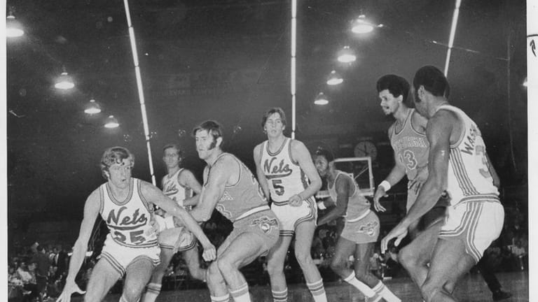 Bill Melchionni of the New York Nets drives for a...