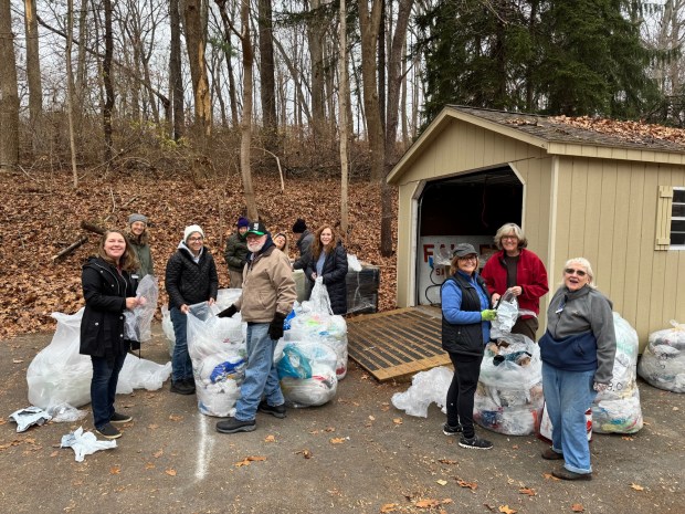 Sorting, bundling and weighing their collection of plastic bags before sending them off to be made into benches to place in Smedley Park for the public's enjoyment, are, from left, Delaware County Master Gardeners Amy Benninger, Karen Murphy, Donna Francher, Stephen Hinks, Steve Rodgers, Lisarose Ferri, Avery Rome, Katie McGeady, Cathy Weaver, Di Turk and Pauline Myers. (COURTESY OF DEB SOUTAR)