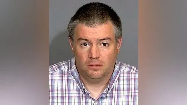 David White, 38, was arrested and held on suspicion of murder after authorities said he killed his mother and stepfather with garden tools outside their home Saturday. (Indianapolis Metropolitan Police Department)