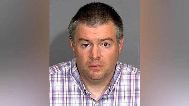 David White, 38, was arrested and held on suspicion of murder after authorities said he killed his mother and stepfather with garden tools outside their home Saturday.  (Indianapolis Metropolitan Police Department)