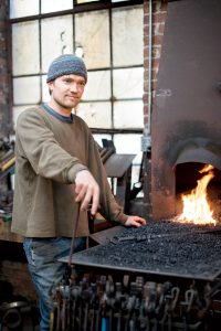 Metalsmith Lucas House stokes the fires at Antfarm Studios in the Warehouse District.