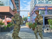 Armed members of the National Guard from multiple states patrol The Wharf in Washington D.C. on orders from Pres. Donald Trump, Aug. 25, 2025.